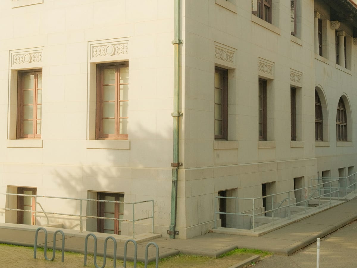 Spanish-revival commercial building with arched windows